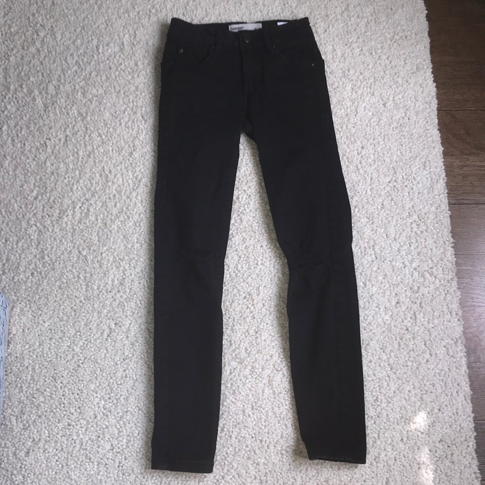 black jeans with rips in knees